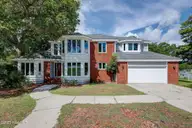 112 Coastal Bluffs Court, Hampstead, NC 28443 — 4-bedroom waterfront home in Olde Point, Hampstead, NC, photo 10 of 37: Front Elevation