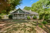 622 Oyster Bay Drive, Sunset Beach, NC 28468 — 3-bedroom home in Sea Trail Plantation, Sunset Beach, NC, photo 6 of 68: 3 Season room with large deck