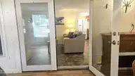 2495 Barracuda Street SW, Supply, NC 28462 — 2-bedroom manufactured home in Sandy Shoals, Supply, NC, photo 10 of 54: Glass Doors into Living Area