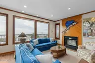 111 Dogwood Circle, Pine Knoll Shores, NC 28512 — 4-bedroom waterfront home in Pine Knoll Association, Pine Knoll Shores, NC, photo 19 of 52: Living room with fireplace