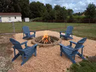 2103 Hilltop Lane, Goldsboro, NC 27530 — 3-bedroom home in Westover, Goldsboro, NC, photo 6 of 21: Fire pit virtually staged