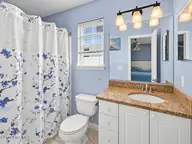 121 NE 6th Street, Oak Island, NC 28465 — 3-bedroom home in Tranquil Harbor, Oak Island, NC, photo 13 of 21: Bath