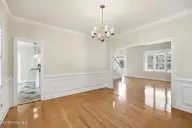 104 Talford Drive, Atlantic Beach, NC 28512 — 4-bedroom home in Ocean Ridge ll, Atlantic Beach, NC, photo 14 of 63: Dining room into living room and kitchen
