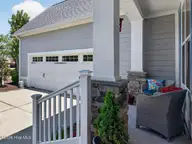 4221 Skeffington Court, Southport, NC 28461 — 3-bedroom waterfront home in St James, Southport, NC, photo 11 of 71: Courtyard Entry Two Car Garage