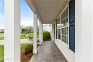 4930 N Hampton Drive SE, Southport, NC 28461 — 3-bedroom waterfront home in Carolina Place, Southport, NC, photo 6 of 58: Front porch