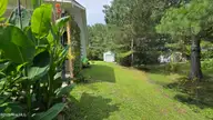 108 Willowbend Drive, Burgaw, NC 28425 — 3-bedroom home in Tealbriar, Burgaw, NC, photo 20 of 27: Natural treeline