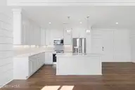 805 Mulberry Street 206, Beaufort, NC 28516 — 2-bedroom condo in 805 Mulberry, Beaufort, NC, photo 9 of 22: Kitchen with Island Open to Living Area