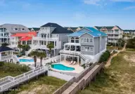 349 W First Street, Ocean Isle Beach, NC 28469 — 6-bedroom waterfront home in Islander Resort, Ocean Isle Beach, NC, photo 3 of 74: Screen Shot 2025-04-01 at 2.39.56 PM