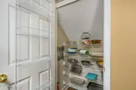 514 Woods Court SW, Sunset Beach, NC 28468 — 3-bedroom home in Sea Trail Plantation, Sunset Beach, NC, photo 21 of 50: 57-web-or-mls-48 kitchen pantry