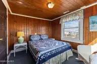 202 Glenn Street, Atlantic Beach, NC 28512 — 5-bedroom waterfront home in Money Island Beach, Atlantic Beach, NC, photo 14 of 21: Bedroom 1