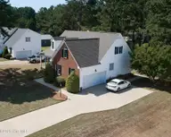 4530 Dewfield Drive N, Wilson, NC 27896 — 4-bedroom home in Dewfield, Wilson, NC, photo 6 of 41: 4530 Dewfield - Drone front right