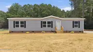 9757 Fire Tower Farm Road, Whitakers, NC 27891 — 3-bedroom manufactured home in Swift Creek Fire Tower, Whitakers, NC, photo 2 of 48: 2-web-or-mls-DJI_20260820132038_0542_D-E