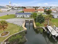 100 E Bogue Sound Drive, Atlantic Beach, NC 28512 — 4-bedroom waterfront home, Atlantic Beach, NC, photo 2 of 52: Back and Boat lifts
