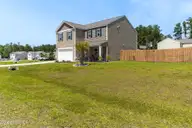 26 Fresh Air Drive, Hampstead, NC 28443 — 4-bedroom home in Hope Creek, Hampstead, NC, photo 5 of 39: Front Yard