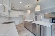 125 Cove Side Lane, Hampstead, NC 28443 — 4-bedroom waterfront home in Pelican Sound, Hampstead, NC, photo 11 of 29: kitchen3
