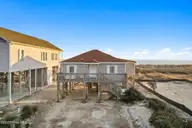 4025 E Beach Drive, Oak Island, NC 28465 — 3-bedroom waterfront home in Long Beach, Oak Island, NC, photo 3 of 40: 2-web-or-mls-CAMMediaLLC.com (2 of 47)