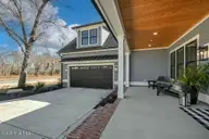 9143 Fallen Pear Lane NE, Leland, NC 28451 — 4-bedroom home in The Bluffs on the Cape Fear, Leland, NC, photo 4 of 65: 9143FallenPearMLSEXTERIORS10-3