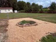 2103 Hilltop Lane, Goldsboro, NC 27530 — 3-bedroom home in Westover, Goldsboro, NC, photo 5 of 21: Firepit