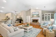 618 Oyster Bay Drive, Sunset Beach, NC 28468 — 3-bedroom home in Sea Trail Plantation, Sunset Beach, NC, photo 9 of 62: Coastal living room with beach-inspired