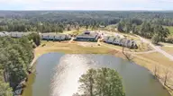 490 Little River Farm Boulevard 101a, Carthage, NC 28327 — 2-bedroom condo in Little River Fa, Carthage, NC, photo 6 of 19: Drone overview all buildings from roadsi