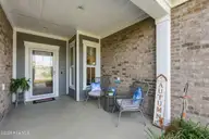 1068 Snowden Road, Wilmington, NC 28412 — 3-bedroom home in Riverlights - Del Webb, Wilmington, NC, photo 6 of 74: 6_front door & porch