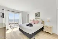 1003 Pelican Court 1003, Kure Beach, NC 28449 — 3-bedroom waterfront condo in Ocean Dunes, Kure Beach, NC, photo 22 of 45: 1003 Pelican Ct-large-027-032-Master Bed