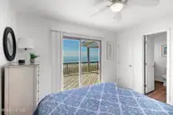 1819 Salter Path Road, Indian Beach, NC 28512 — 5-bedroom waterfront home in Roosevelt Estate, Indian Beach, NC, photo 24 of 58: Primary bedroom suite w/ great views