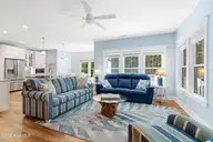 121 Sea Isle North Drive & Slip 20, Indian Beach, NC 28512 — 3-bedroom waterfront home in Sea Isle Plantation North, Indian Beach, NC, photo 11 of 53: Living room with porch access
