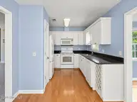 121 NE 6th Street, Oak Island, NC 28465 — 3-bedroom home in Tranquil Harbor, Oak Island, NC, photo 7 of 21: Kitchen View