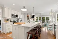 152 Arborvitae Drive, Pine Knoll Shores, NC 28512 — 3-bedroom waterfront home in Pine Knoll Association, Pine Knoll Shores, NC, photo 18 of 61: Kitchen with Great room