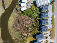 825a N New River Drive, Surf City, NC 28445 — 4-bedroom waterfront townhome, Surf City, NC, photo 8 of 49: 037_dji_20261001120151_0102_d_644