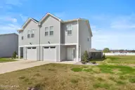 119 Pasture Lane B, Peletier, NC 28584 — 2-bedroom townhome in The Flatts at Coldwater Creek, Peletier, NC, photo 1 of 31: Front Exterior