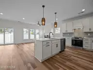 128 Pine View Boulevard, Beaufort, NC 28516 — 3-bedroom home in Beau Coast West, Beaufort, NC, photo 4 of 37: Kitchen & Living