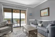 106 N Water Street 907, Wilmington, NC 28401 — 1-bedroom condo in Water Street Center Condo, Wilmington, NC, photo 8 of 34: Living Room - Balcony