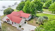 995 Chadwick Shores Drive, Sneads Ferry, NC 28460 — 4-bedroom waterfront home in Chadwick Shores, Sneads Ferry, NC, photo 4 of 69: 7_drone
