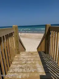 124 Shell Road, Surf City, NC 28445 — 3-bedroom waterfront townhome in Dune Ridge, Surf City, NC, photo 6 of 33: 124 Dune Ridge walkover view