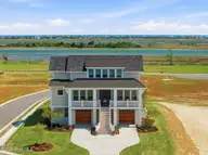 26 Solstice Way, Hampstead, NC 28443 — 4-bedroom waterfront home in East Wynd, Hampstead, NC, photo 1 of 55: Front Exterior