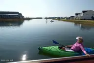 5704 Moonshell Loop, Wilmington, NC 28412 — 4-bedroom home in Riverlights, Wilmington, NC, photo 11 of 23: Kayak on Riverlights lake