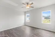 1099 Hanson Drive, Leland, NC 28451 — 3-bedroom home in East Lake, Leland, NC, photo 10 of 16: Nest - Primary Bedroom