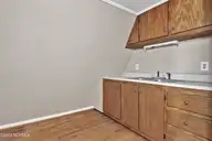 2645 Scotts Hill Loop Road, Wilmington, NC 28411 — 3-bedroom home in Scotts Hill, Wilmington, NC, photo 24 of 28: kitchen above garage