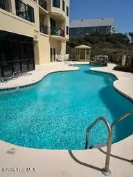 801 Salter Path Road 108, Indian Beach, NC 28512 — 1-bedroom waterfront condo in Windward Dunes, Indian Beach, NC, photo 3 of 12: Outside Pool
