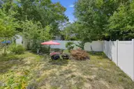 121 NE 6th Street, Oak Island, NC 28465 — 3-bedroom home in Tranquil Harbor, Oak Island, NC, photo 19 of 21: 07_121_NE_6th_St-Exterior-GE13