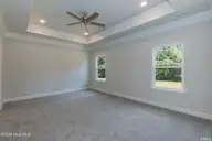 123 White Bark Avenue Lot 18, Rocky Mount, NC 27804 — 3-bedroom home in Longneedle, Rocky Mount, NC, photo 18 of 24: Primary Bedroom With Tray Ceilings 1522