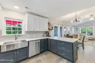 1803 W Yacht Drive, Oak Island, NC 28465 — 3-bedroom home in Pinners Point, Oak Island, NC, photo 13 of 39: Kitchen to Dining