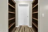 552 Colonial Landing Road SE, Bolivia, NC 28422 — 2-bedroom waterfront manufactured home in Vineyard Landing, Bolivia, NC, photo 17 of 52: 17-web-or-mls-Pantry shelving