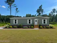 1319 Bill Hooks Road, Whiteville, NC 28472 — 3-bedroom manufactured home, Whiteville, NC, photo 2 of 24: AI generated landscaping