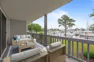2201 Harbourside Drive, New Bern, NC 28560 — 1-bedroom waterfront condo in Fairfield Harbour, New Bern, NC, photo 8 of 46: virtually staged deck