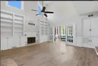 2204 Darien Place NW, Wilson, NC 27896 — 4-bedroom home in Waterford, Wilson, NC, photo 17 of 77: Family room with Bookcases