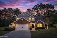 14 Calabash Lakes Boulevard, Carolina Shores, NC 28467 — 3-bedroom home in Calabash Lakes, Carolina Shores, NC, photo 12 of 61: Twilight serenity in suburban home