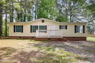 211 Pond Road, Rocky Point, NC 28457 — 3-bedroom manufactured home in Arvida Lands, Rocky Point, NC, photo 1 of 36: 1_front exterior